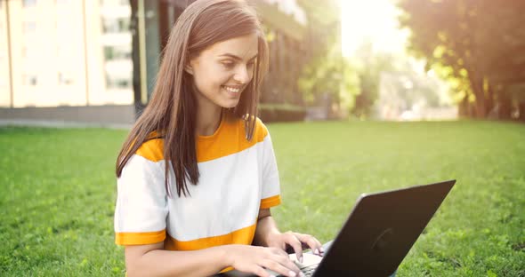 Woman with Laptop Working Outdoors