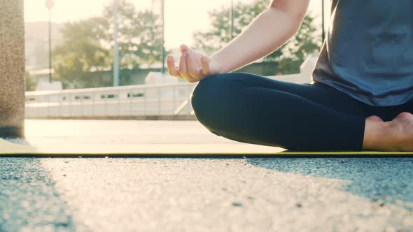 Close up of hands Asian woman sitting in meditation pose position yoga pranayama. alt