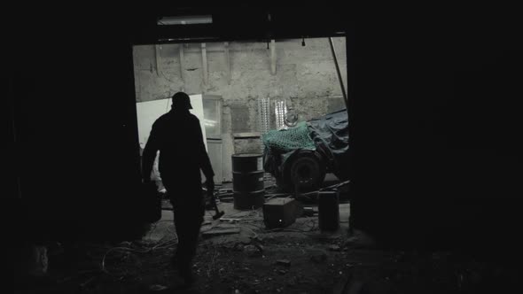 Walking into welding workshop night WIDE SHOT alt