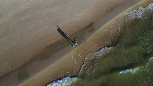 Aerial View Of Backpacker Hiking On The Beach In Seaside