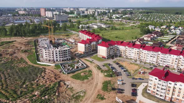 Aerial View of a Modern Apartment Building Under Construction alt
