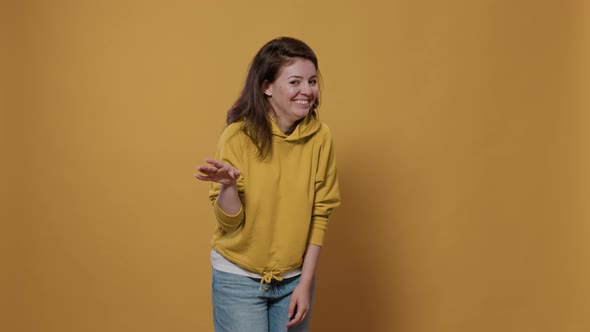 Young Woman Posing Shy Feeling Embarrassed and Awkward Asking Please Stop with Timid Gesturing alt