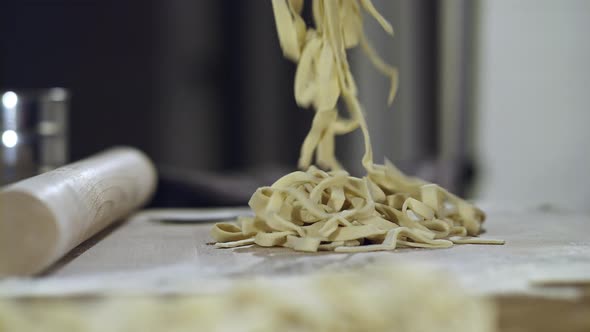 Closeup of Men's Hands Cooking Pasta Pasta From Dough