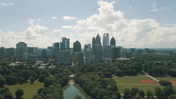 Beautiful drone footage of Midtown Atlanta and Piedmont Park on a bright sunny day alt