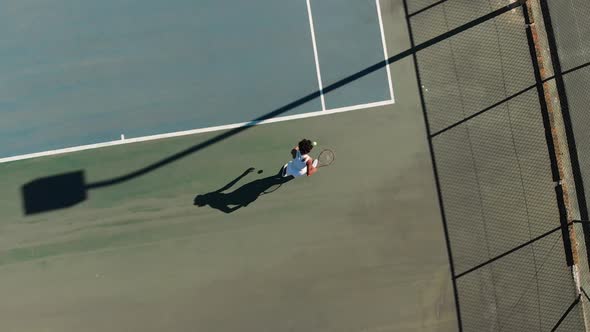 Video of top view of african american female tennis player on court alt