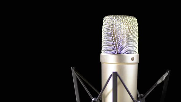Studio Microphone with Spider Rotates on a Black Background alt