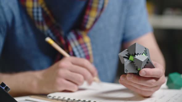 Engineer Working on Prototype of Puzzle Game alt