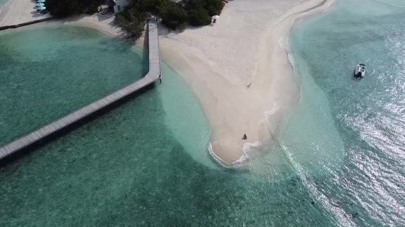 Aerial View of a Tropical Paradise Island Bay Covered in Limestone Trees with Crystal Clear Beach