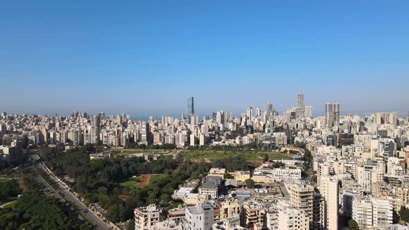 Flyover drone shot of Beirut showing the central park and Beirut Port