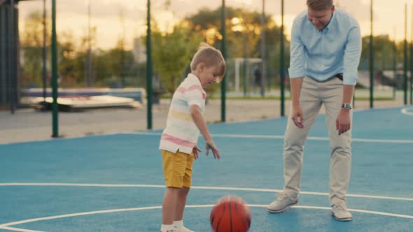 Father and son playing basketball alt