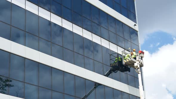 Workers Fix a Business Building