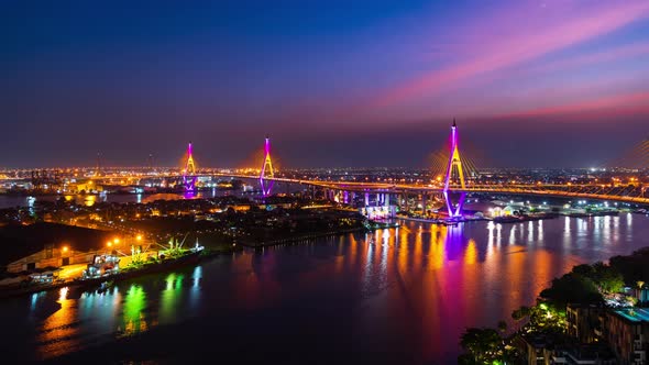 day to night time lapse of Bhumibol suspension bridge cross over Chao Phraya River in Bangkok