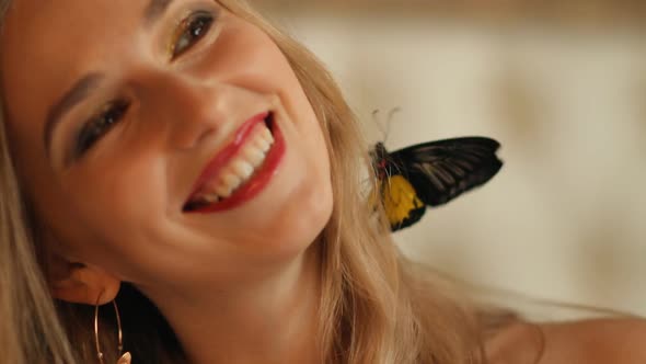 Laughing Woman with a Butterfly in her Hair
