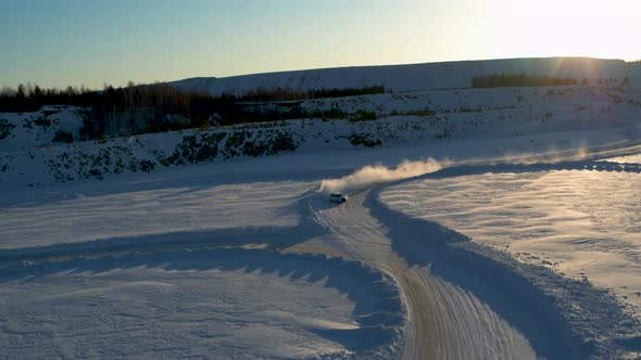 Aerial View of an Ice Rally on a Snowy Track alt