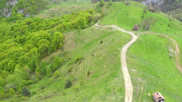 Aerial View of Spring Countryside Mountain Landscape with Wooden Houses, Romania alt