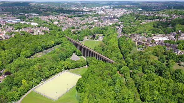 Aerial footage of a scenic view of the Lockwood Viaduct located in the town of Huddersfield in UK alt
