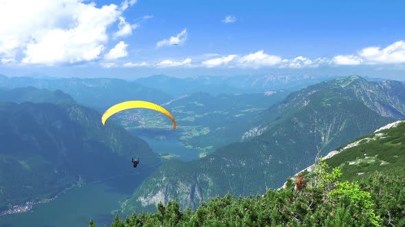 Paraglider over Mountains and Lakes