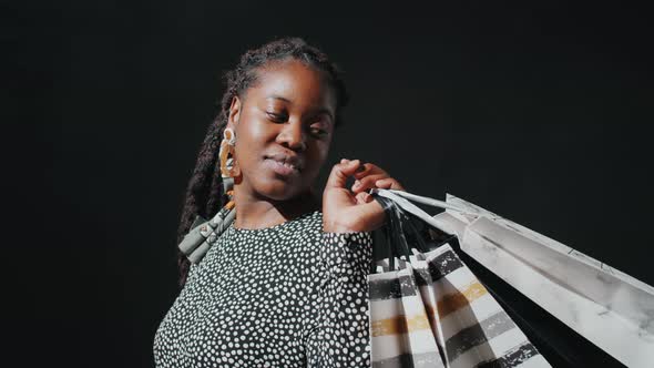 Portrait of Beautiful Black Girl with Shopping Bags alt