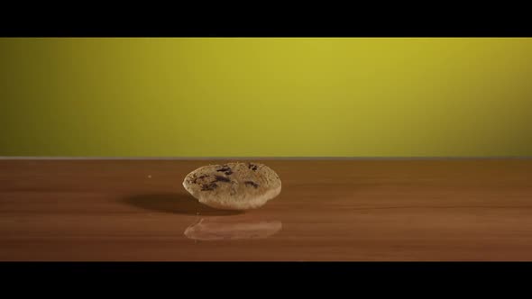 Falling cookies from above onto a reflective surface - COOKIES 024 alt