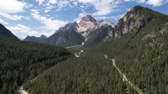 Aerial view of the green mountains forest in Dolomites, Italy alt
