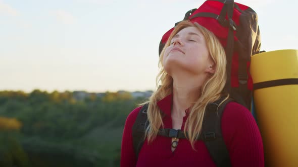 a Young Woman Happily Looking for a Place to Camp on the Mountain Hills During Sunset to Rest After alt