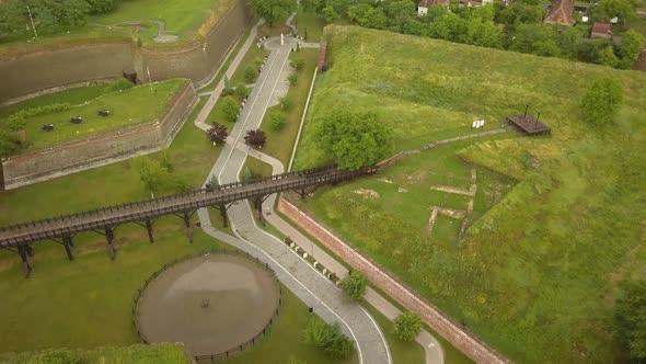 Aerial Top Down shot of Citadel Walls with walking bridge and cobble road , in Alba-Carolina, Alba-I alt