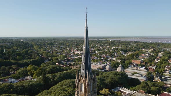 Aerial of San Isidro cathedral revealing neighborhood and La Plata river alt