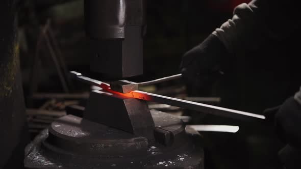 Blacksmith Works with a Hot Metal alt