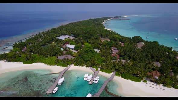 Aerial flying over sky of perfect coast beach lifestyle by blue sea and white sandy background of a  alt