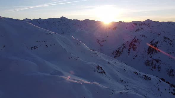 Snowy Mountain Skilifts and Furniculars and Skislopes in Austrian Alps Drone Flyover the Mountains