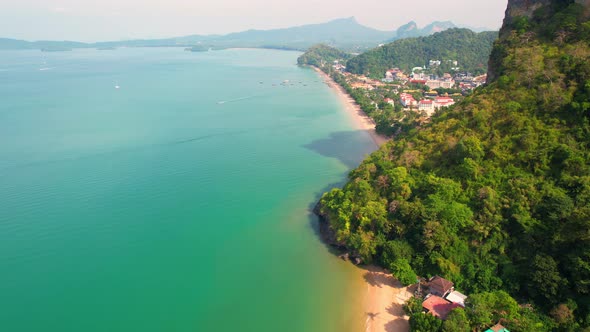 4K aerial view of the beautiful mountain coast of the tropical sea alt