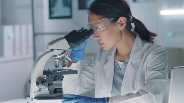 Woman Testing Sample In Lab alt