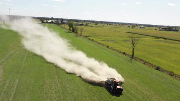 farm tractor spreading white powder front rotating view alt