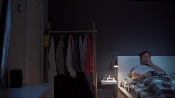 Man Binge Watching Television Via Online Streaming Service Late Night alt