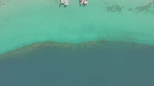 Aerial view of Kournas Lake, in Greece. Little pier with pedal boats alt