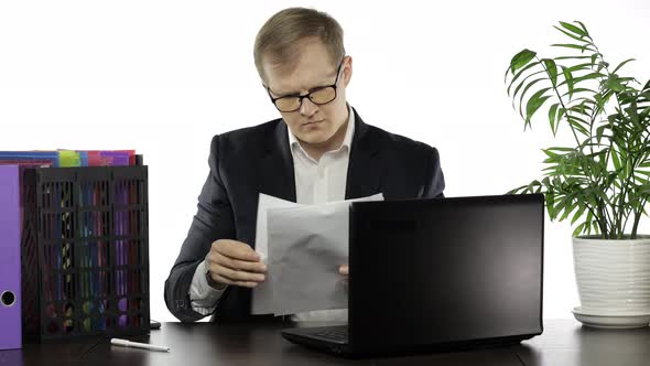 Businessman Working in Office. Negative Amazed of Reading Paper Full of Mistakes alt