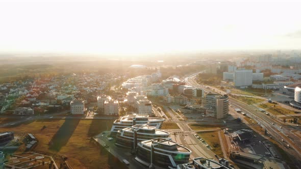 Drone Flying Above Modern City Buildings and Parks Panorama in Minsk, Belarus During Sunrise on alt