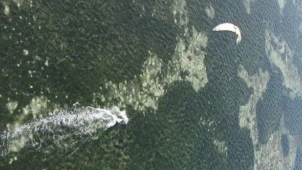 Vertical Video Kitesurfing Near the Shore of Zanzibar Tanzania Aerial View alt