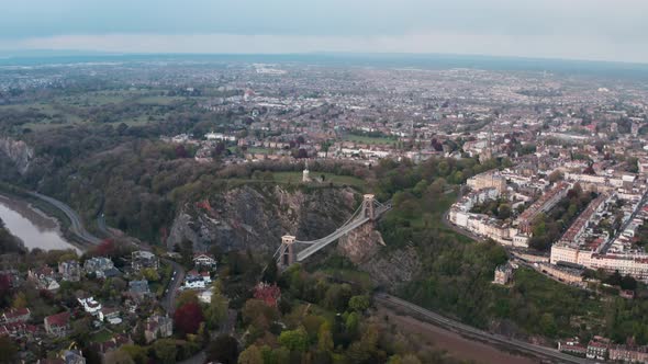 Circling rising drone shot of the Clifton suspension bridge and Bristol alt