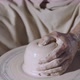 The Potter&#39;s Male Hands Shape and Sculpt the Soft White Clay Pot Spinning on a Potter&#39;s Wheel in a - VideoHive Item for Sale