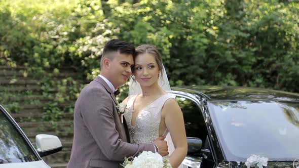 A loving couple walks around the city on their wedding day alt