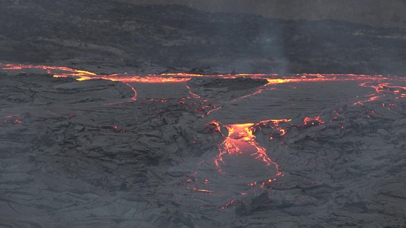 Volcanic eruption in Iceland. Impressive view of the exploding red lava from the Active Volcano. alt