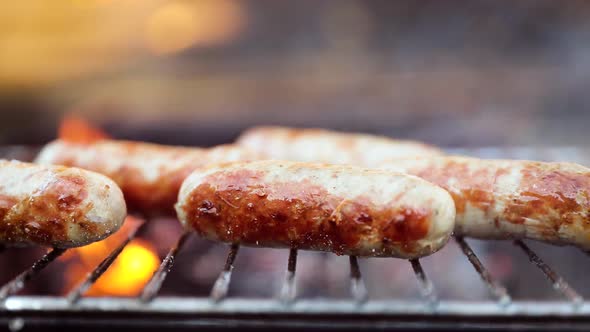 Delicious Juicy Sausages, Cooked on the Grill with a Fire alt