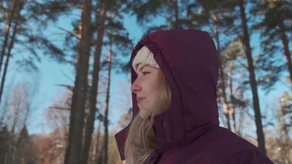 A Young Happy Girl Rubs Her Hands To Keep Warm alt