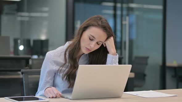 Young African Businessman with Laptop Taking Nap in Office alt