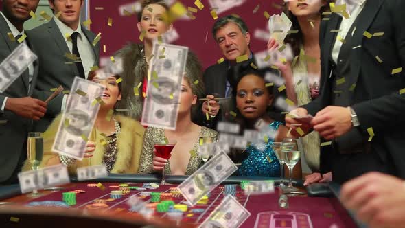 Animation of confetti and american dollar bills falling over people gambling around casino table alt