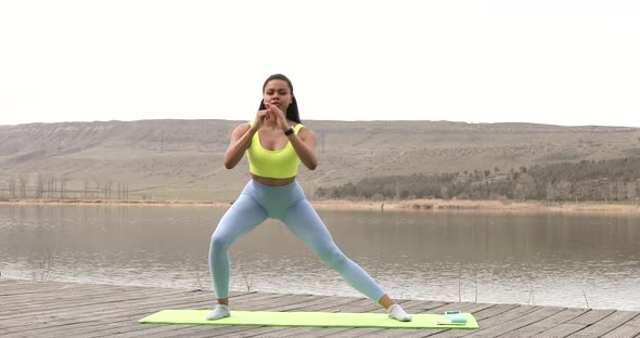 Fitness black woman doing lunges exercises for leg and buttocks muscle.