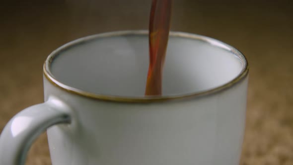 ZOOM IN 60fps, black coffee is poured into a mug alt