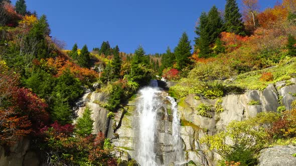 Waterfall In The Autumn Forest