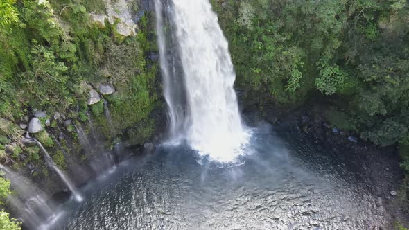 Top-down drone footage of the Grand Bassin waterfall at the Reunion island. alt